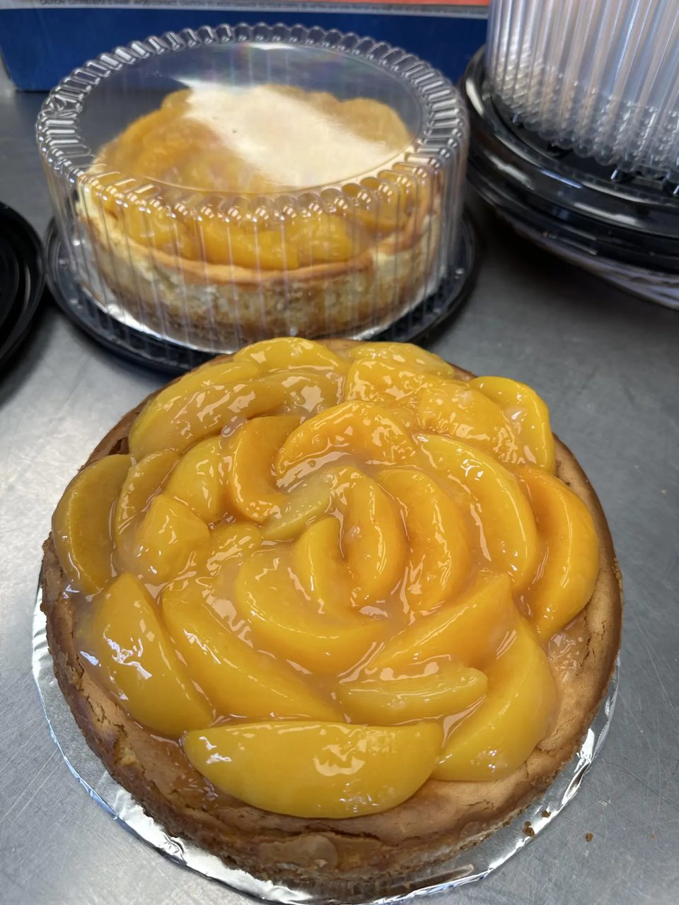 Peach-topped cheesecake prepared at Anita’s Pie Shop.